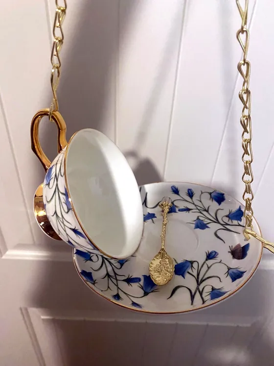 Bluebell Meadow teacup bird feeder hanging on gold chain
